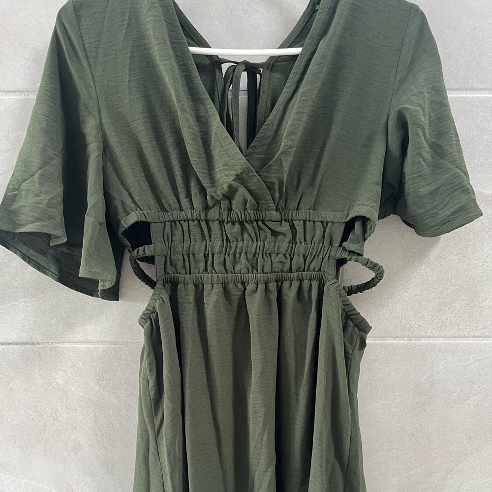 Cute green dress cut out on the sides
